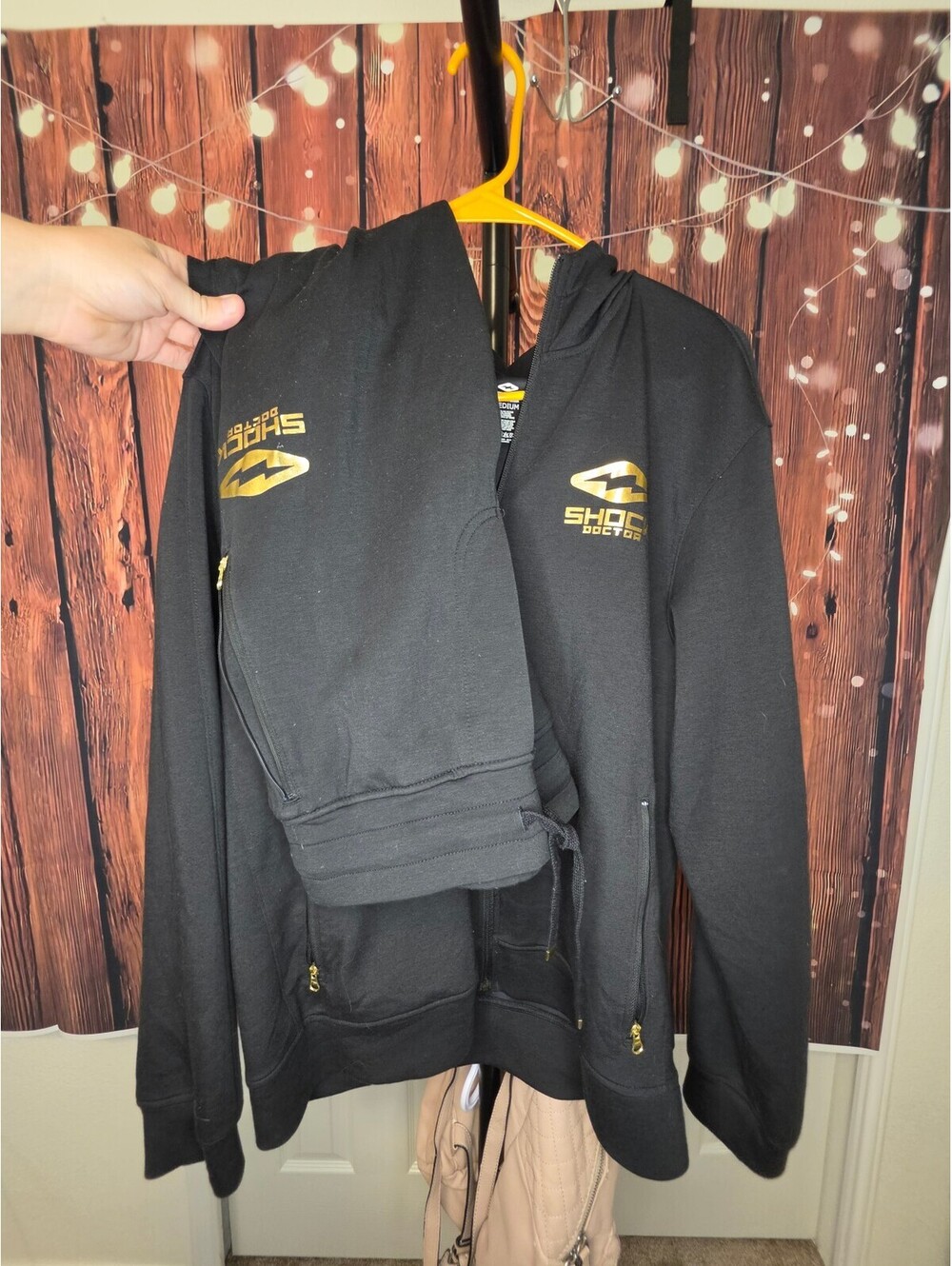 Shock Doctor Black Full Zip Hoodie with Gold Logo and Lightning Bolt Design